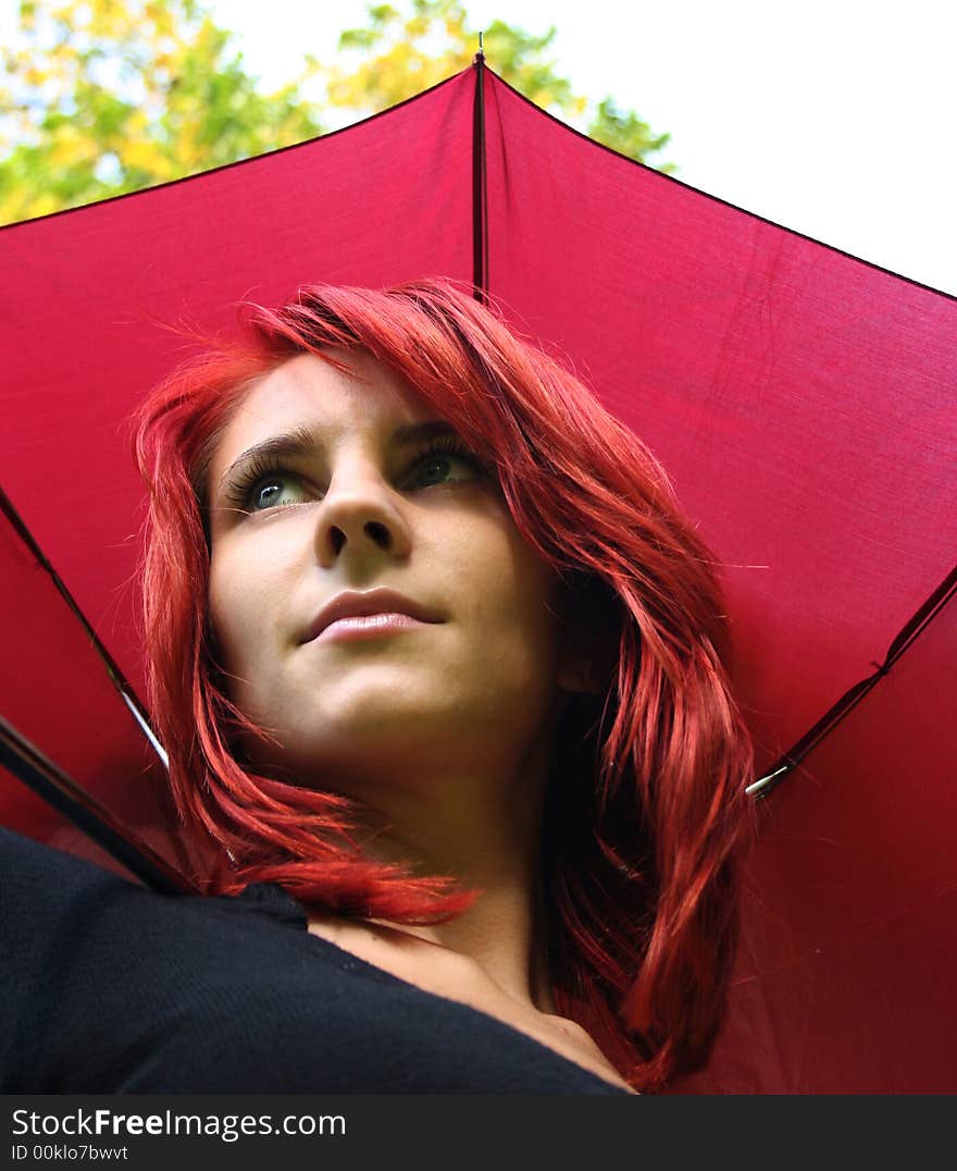 Beautiful girl under red umbrella. Beautiful girl under red umbrella