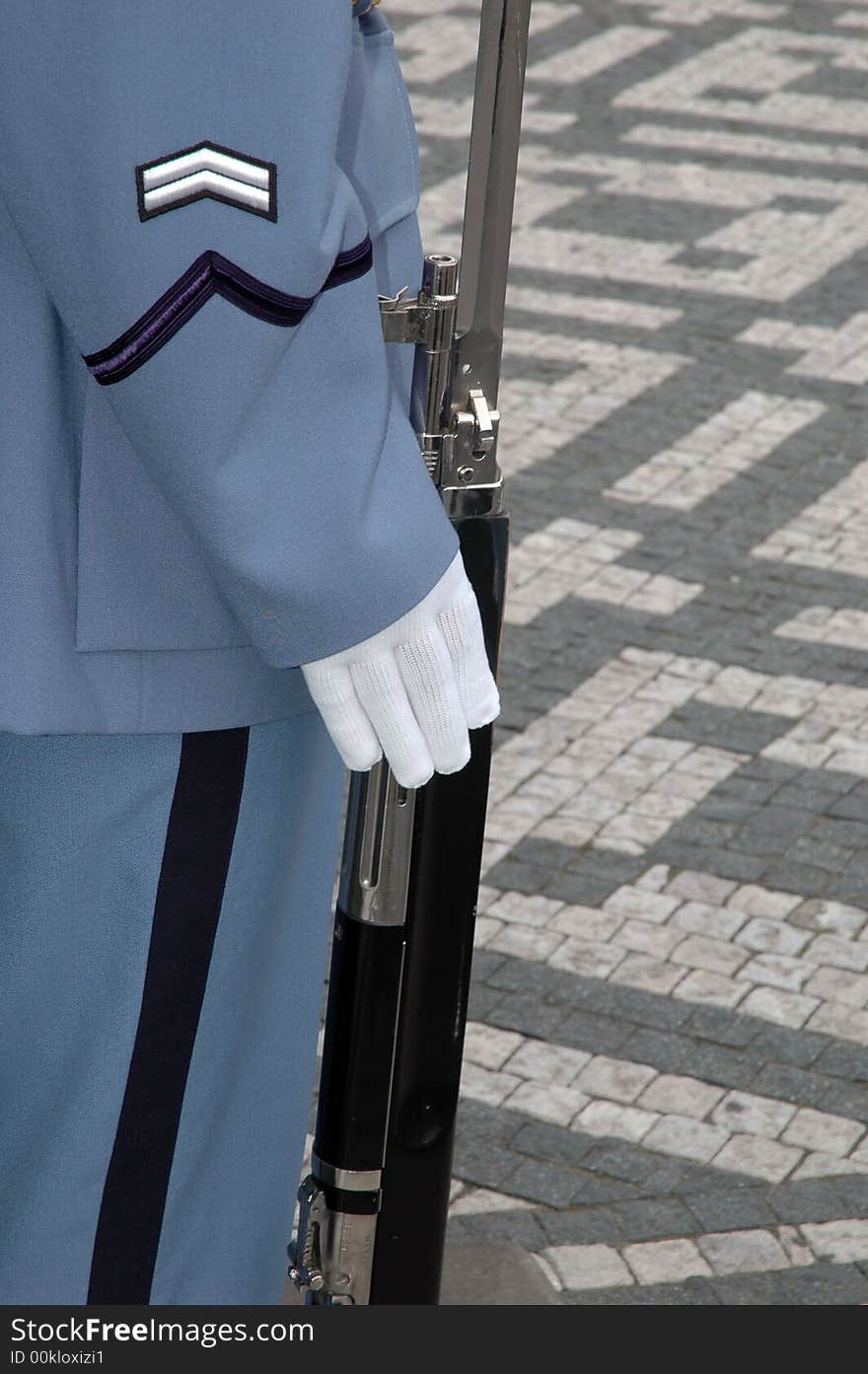 Soldier holding a gun while guarding the castle in Prague, Czech Republic. Soldier holding a gun while guarding the castle in Prague, Czech Republic