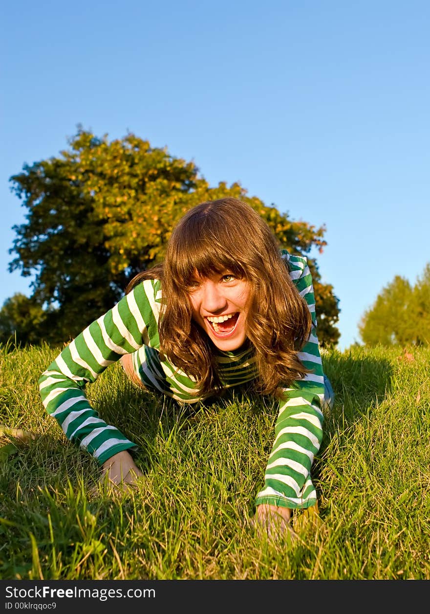 Pretty girl is stolen on a dense green grass. Pretty girl is stolen on a dense green grass