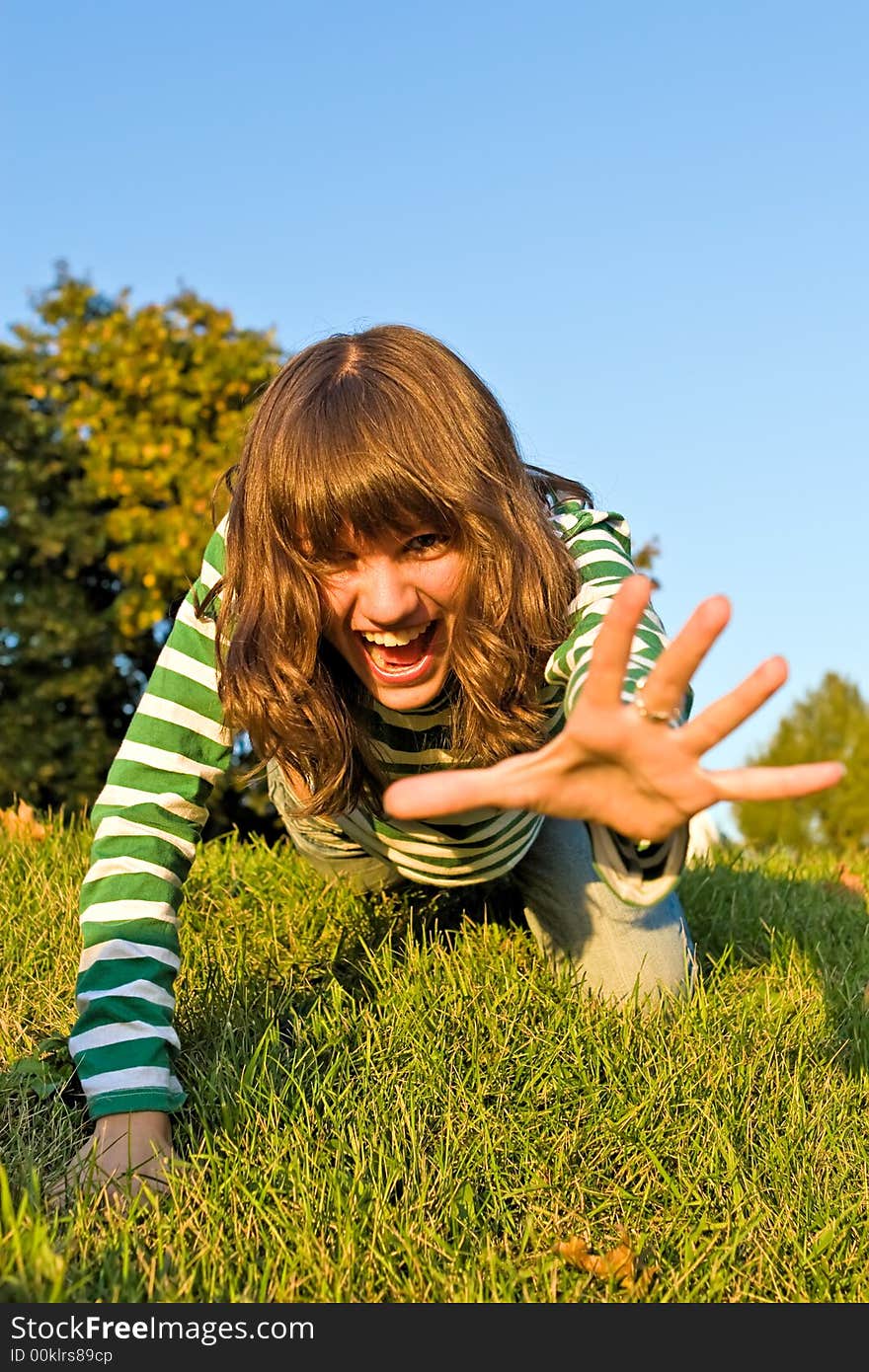 Pretty girl is stolen on a dense green grass. Pretty girl is stolen on a dense green grass