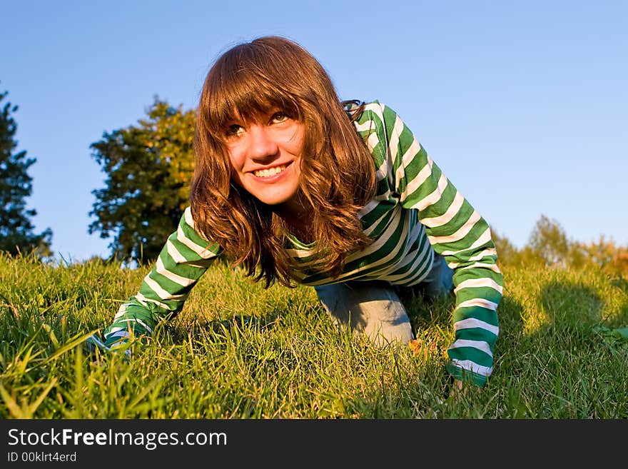 Pretty girl is stolen on a dense green grass. Pretty girl is stolen on a dense green grass