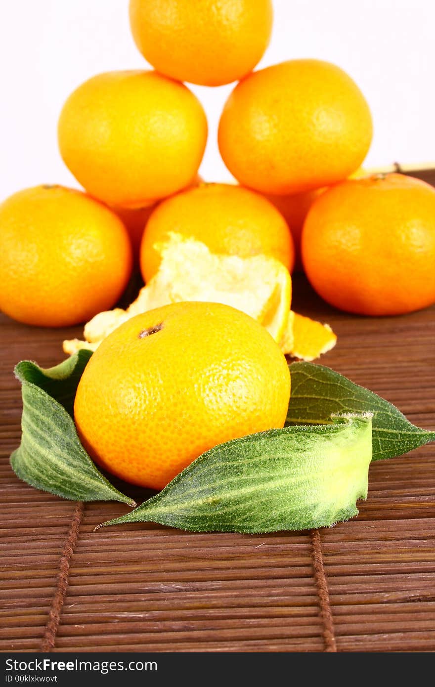 Fresh tangerine and orange isolated on white background