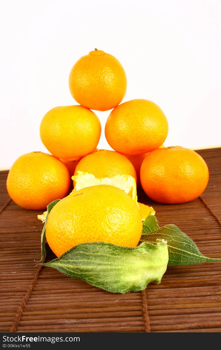 Fresh tangerine and orange isolated on white background