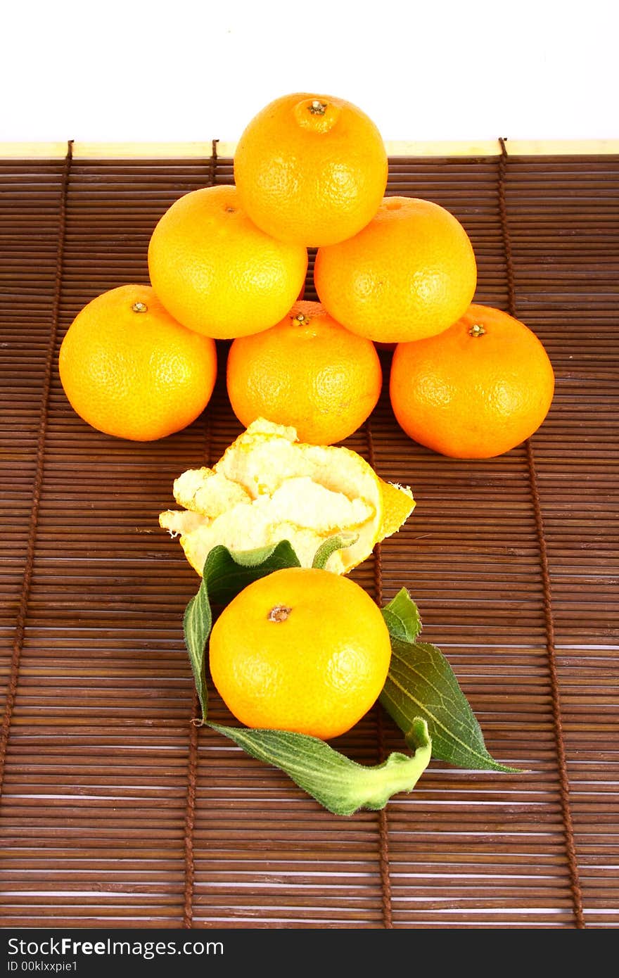 Fresh tangerine and orange isolated on white background