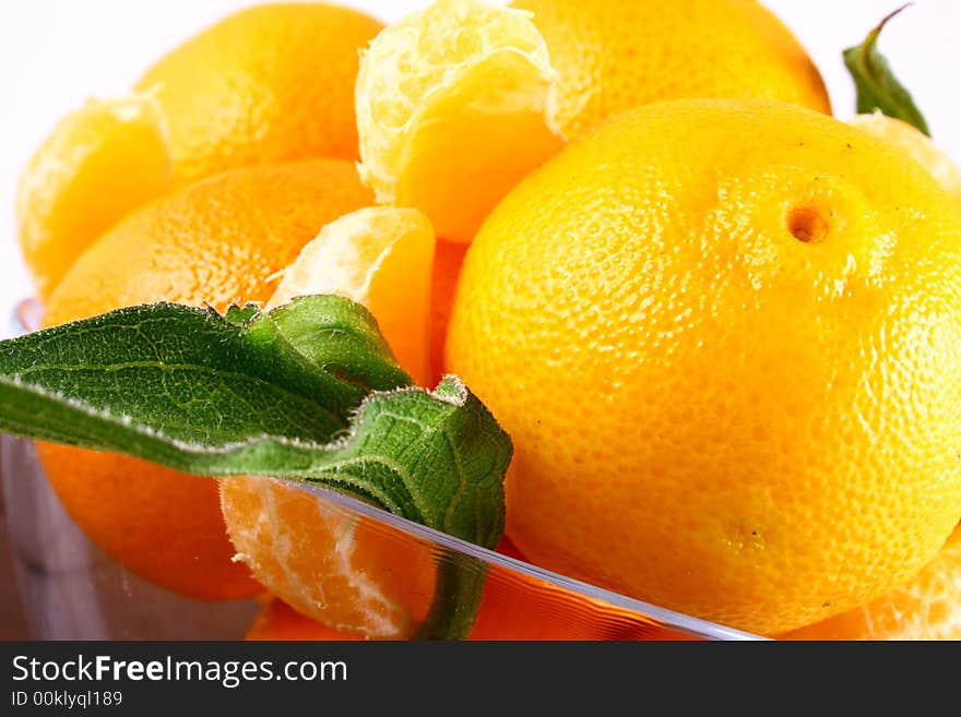 Fresh tangerine and orange isolated on white background