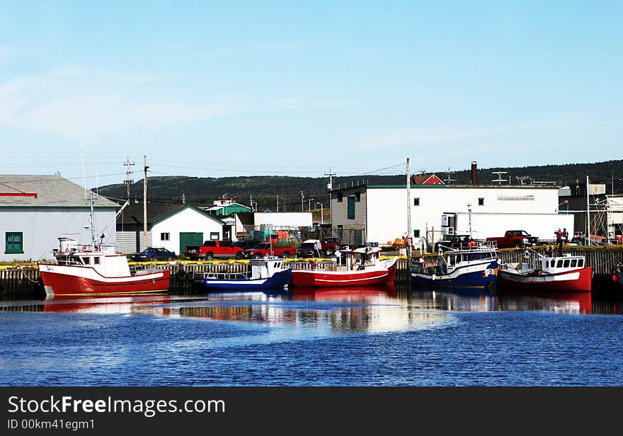 Boats moored at a wharf. Boats moored at a wharf.