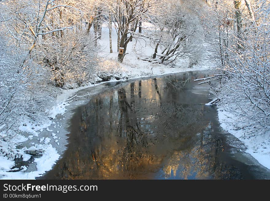 Beautiful wintery river with nice sunny reflections on the water. Beautiful wintery river with nice sunny reflections on the water.