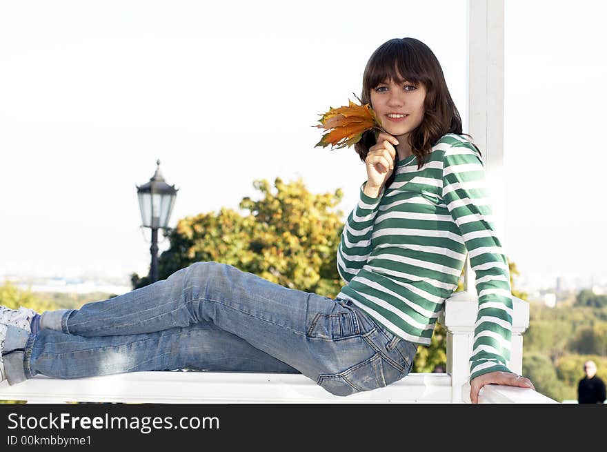 Girl holds autumn tree leafs. Girl holds autumn tree leafs