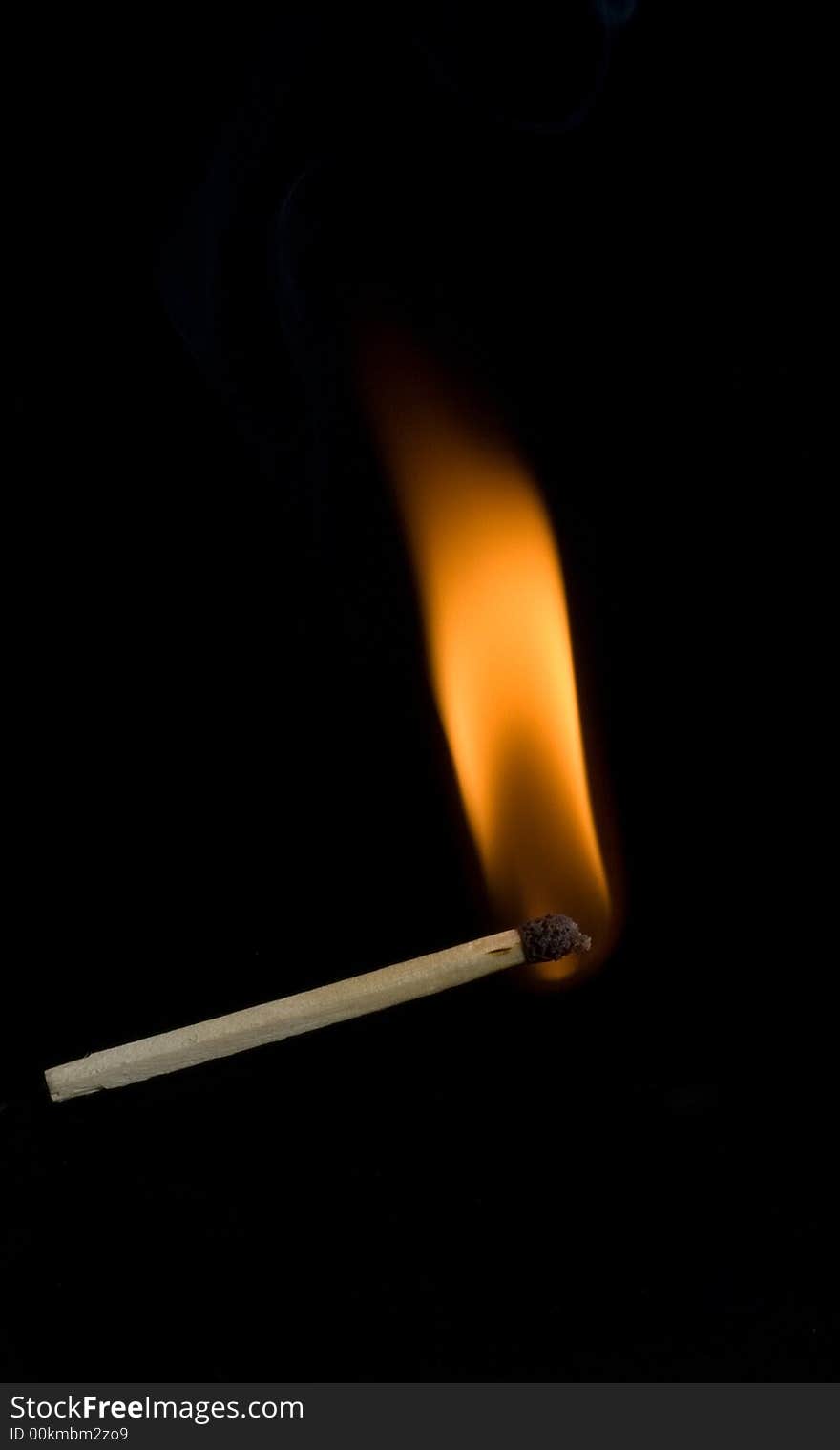 Burning match on black background. Burning match on black background