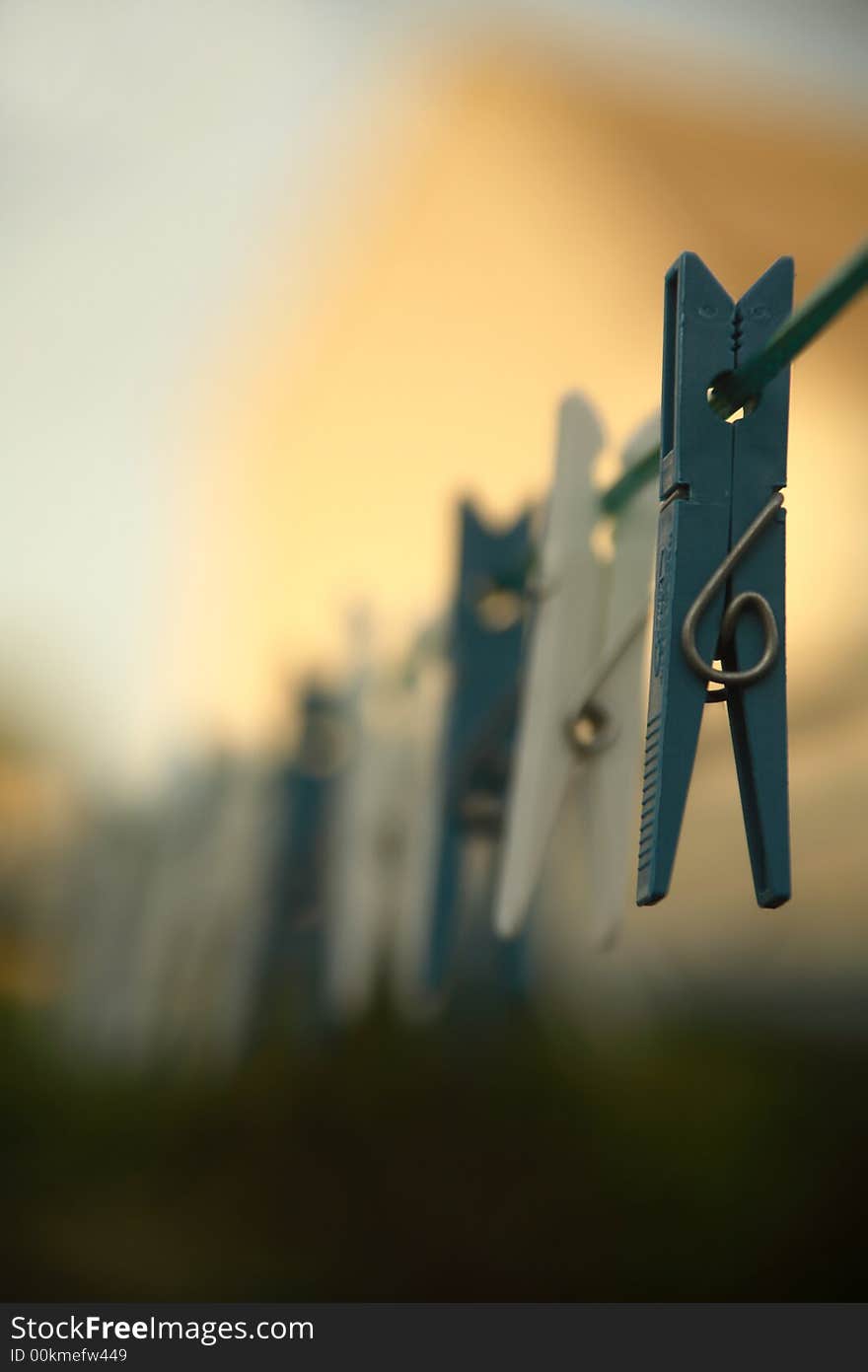 Clothes pegs on a clothes line . (Shallow DOF)