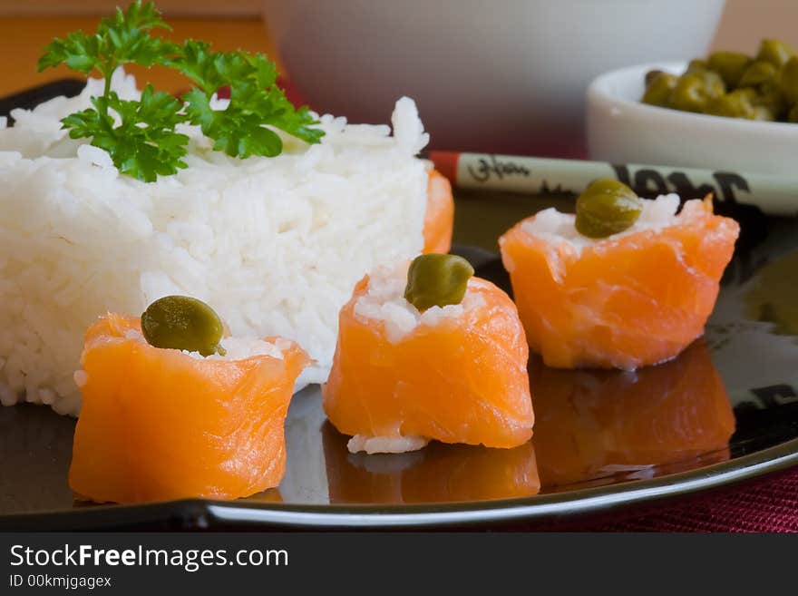 Sushi salmon rolls with boiled rice and caper. Sushi salmon rolls with boiled rice and caper