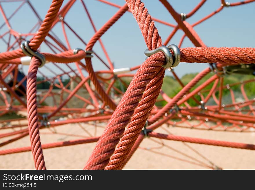 The red rope of climbing equipment in a children's playground