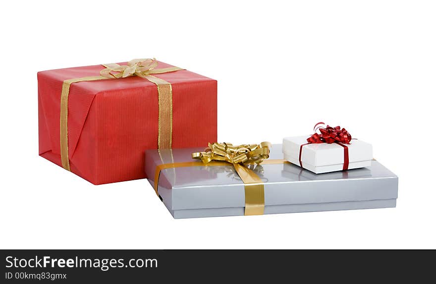 Several well-wrapped christmas gifts deep-etched on a white background. Several well-wrapped christmas gifts deep-etched on a white background