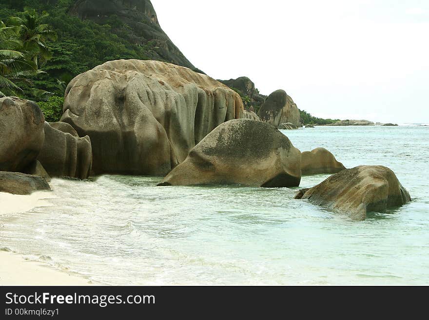 Several huge volcanic stones in the tropical ocean. Several huge volcanic stones in the tropical ocean