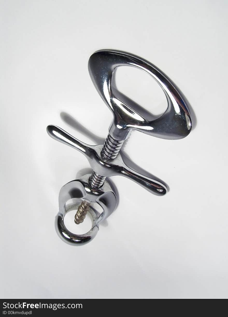 Screw chromeplated corkscrew on a white background