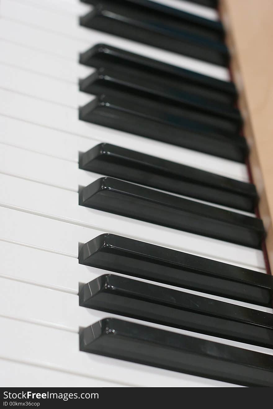 Angle shot of a piano keyboard showing black and white keys