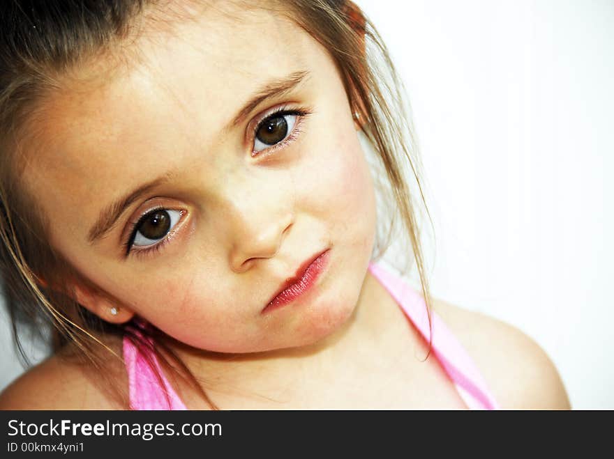 A brunette child looking very serious. A brunette child looking very serious.