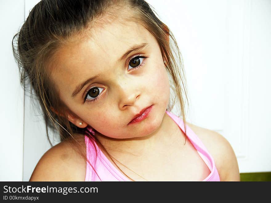 A brunette child looking very serious. A brunette child looking very serious.