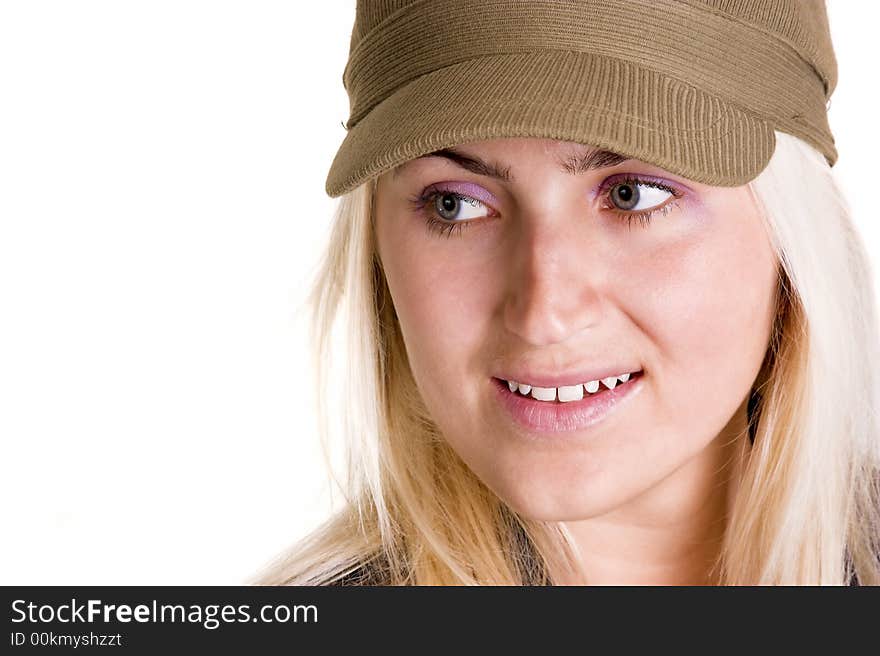 Blond woman wearing a hat looking to the side.