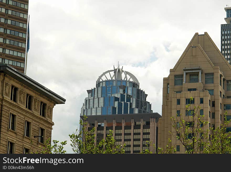 A portion of the boston skyline showing an assortment of old and new buildings. A portion of the boston skyline showing an assortment of old and new buildings