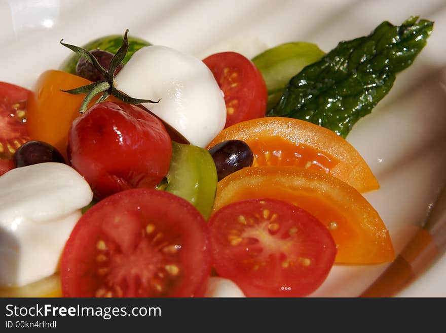 Buffalo mozzarella with four colors of tomatoes