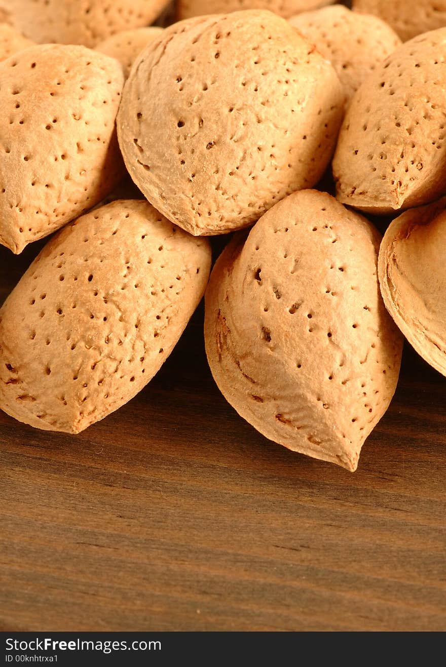 Group of almonds with background of wood