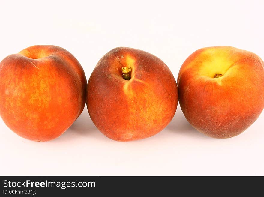 Ripe Peach with Leaf on White Background