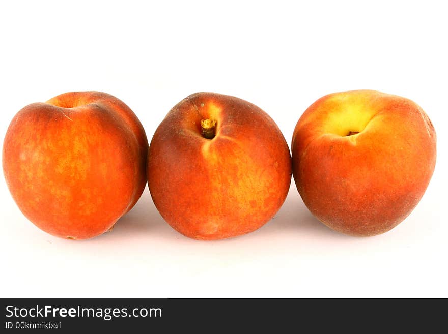 Ripe Peach with Leaf on White Background