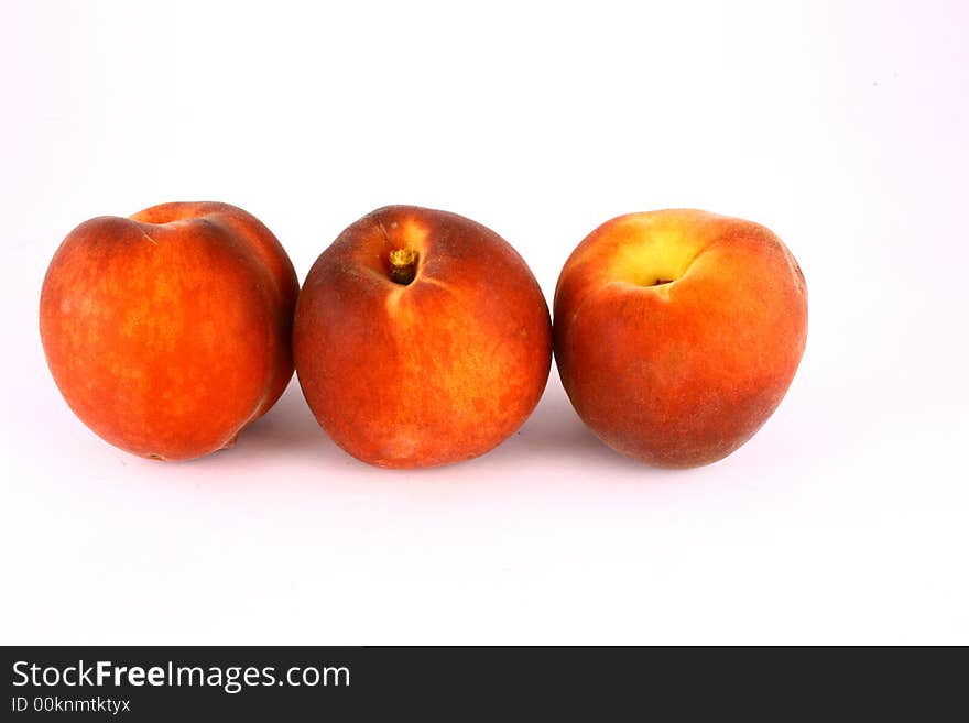 Ripe Peach with Leaf on White Background