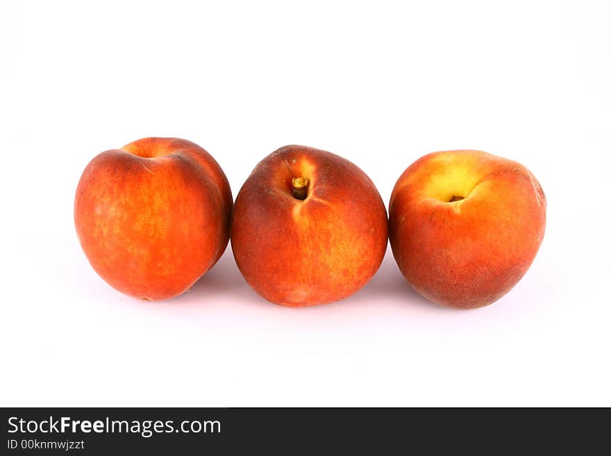 Ripe Peach with Leaf on White Background