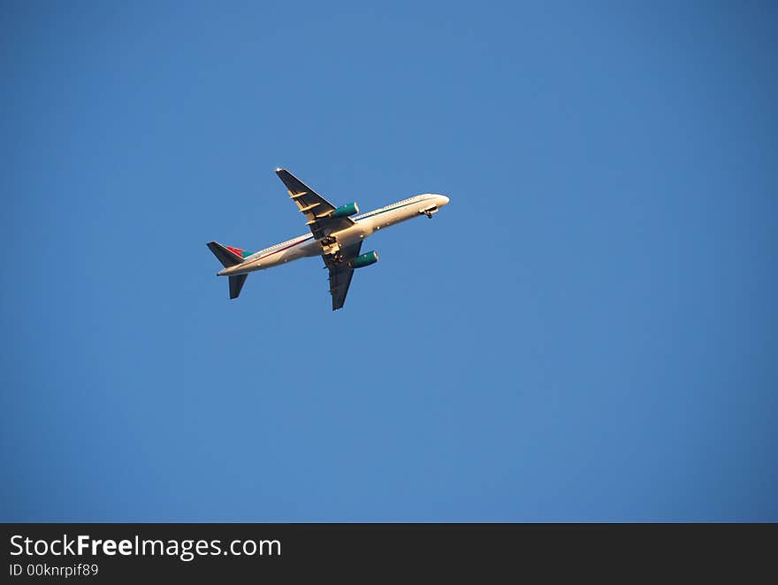 Underside of an airplane flying above