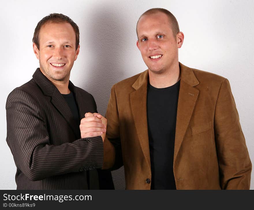 Two you businessmen shaking hands. Isolated studio shot!. Two you businessmen shaking hands. Isolated studio shot!