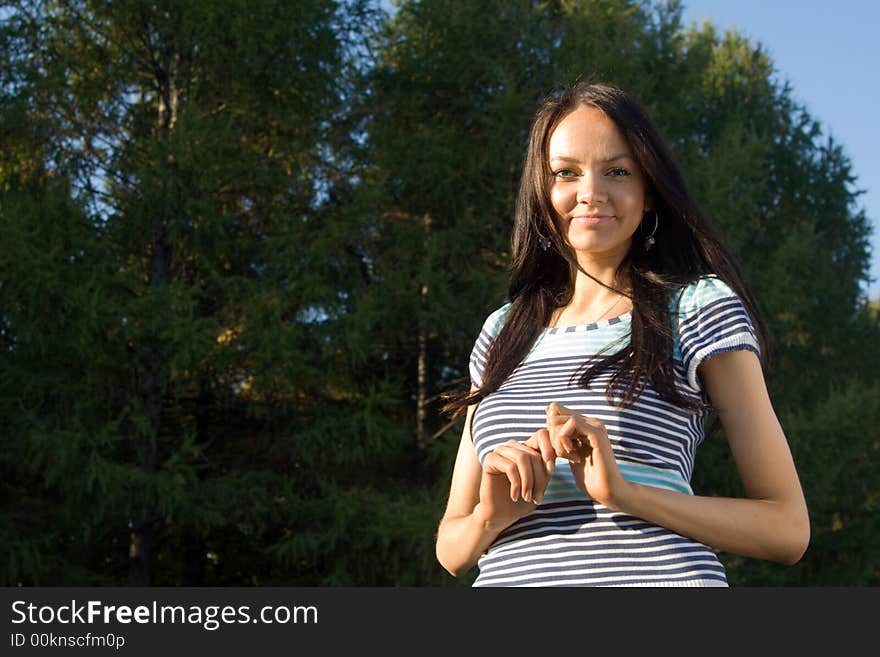 Young beautiful woman smilling at nature. Young beautiful woman smilling at nature