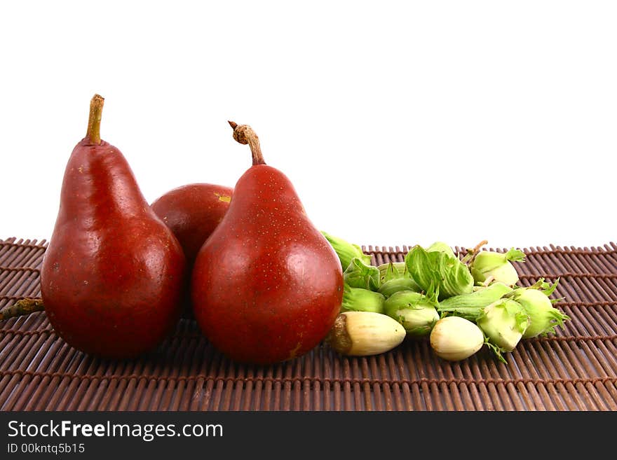 Pear and half of pear on white background