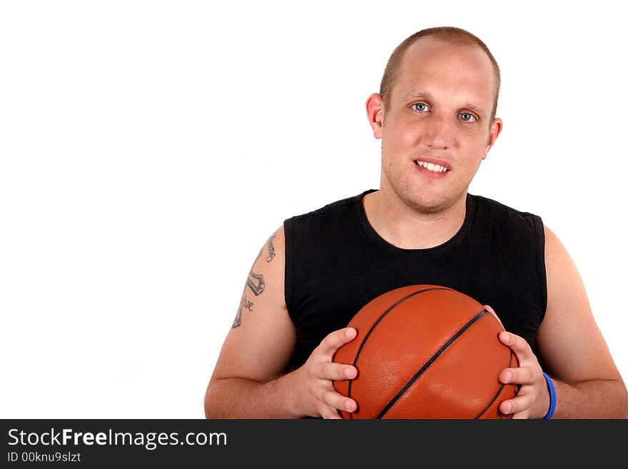 A young man with bright blue eyes and a basketball smiling! Isolated over white!. A young man with bright blue eyes and a basketball smiling! Isolated over white!