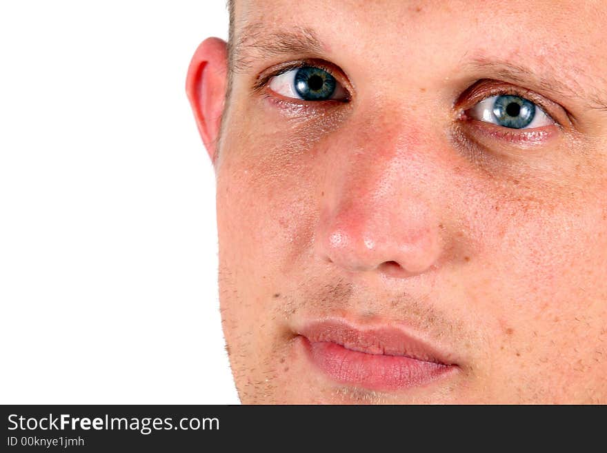 A studio portrait of a young man with blue eyes! Isolated over white!. A studio portrait of a young man with blue eyes! Isolated over white!