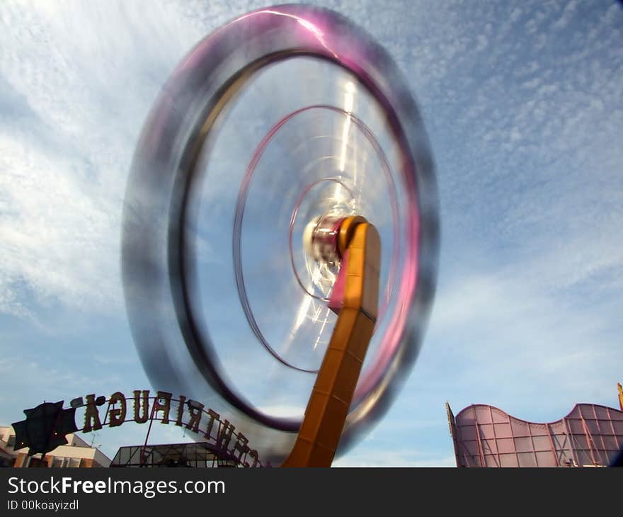 Centrifuge rotating against blue cloudy sky