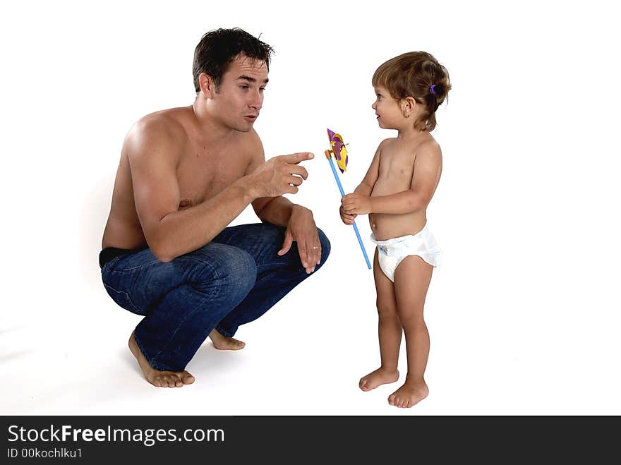 Picture of happy family - father with daughter play with pinwheel