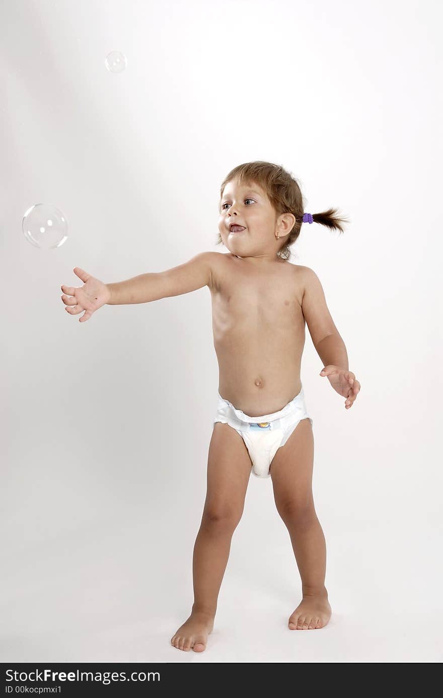 Picture of girl in nappies playing with bubbles. Picture of girl in nappies playing with bubbles