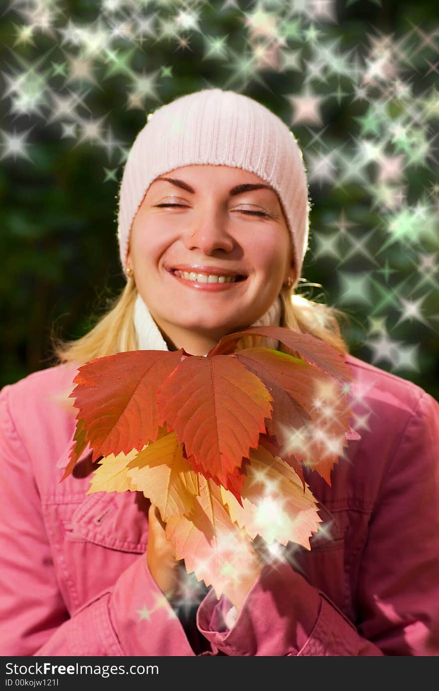 Young girl with autumn leaves