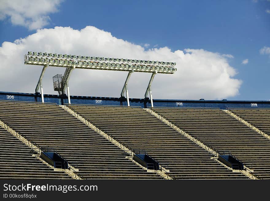 Stadium Lights And A Cloud