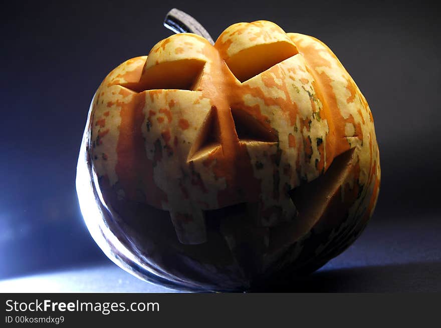 A scary-looking carved pumpkin for Halloween. A scary-looking carved pumpkin for Halloween