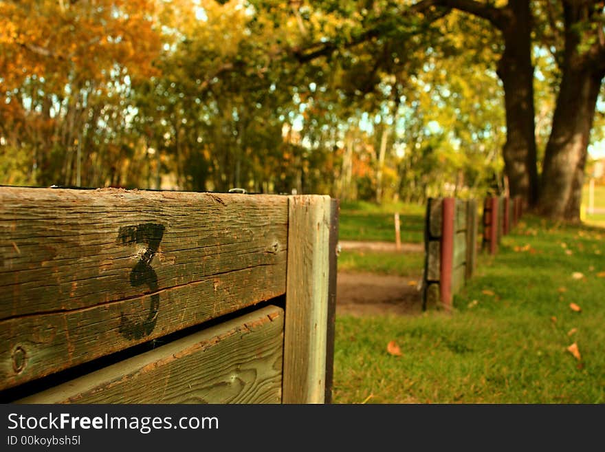 A horseshoe pit in the fall with fallen leaves. A horseshoe pit in the fall with fallen leaves.