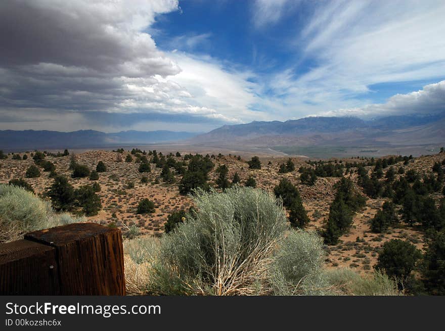 A desert landscape with dramatic sky and colors in California near the city of Bishop.