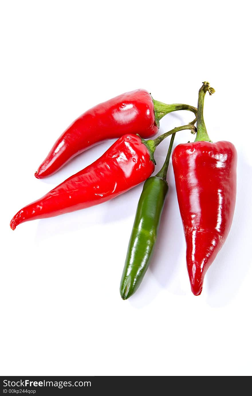 Vertical view of red jalapeno and green hot serrano peppers. Vertical view of red jalapeno and green hot serrano peppers