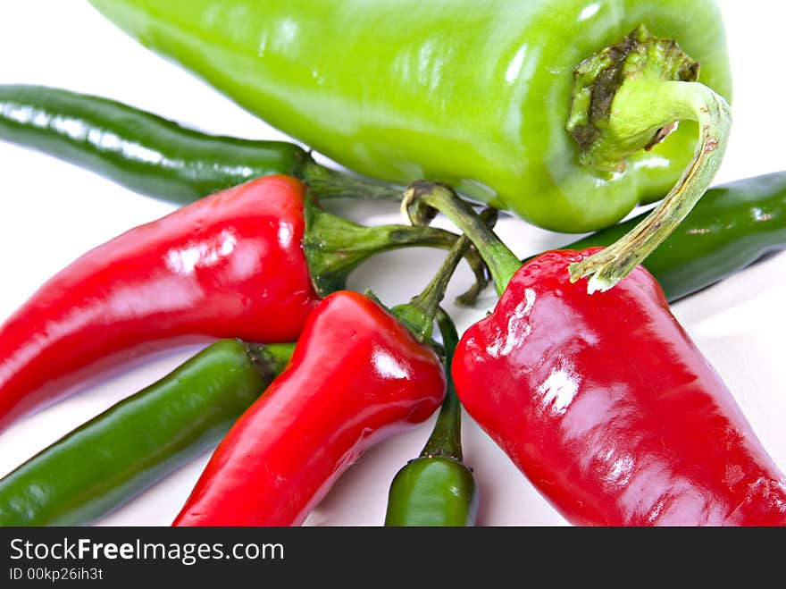 Horizontal color view of anaheim, red jalapeno and green serrano hot peppers. Horizontal color view of anaheim, red jalapeno and green serrano hot peppers