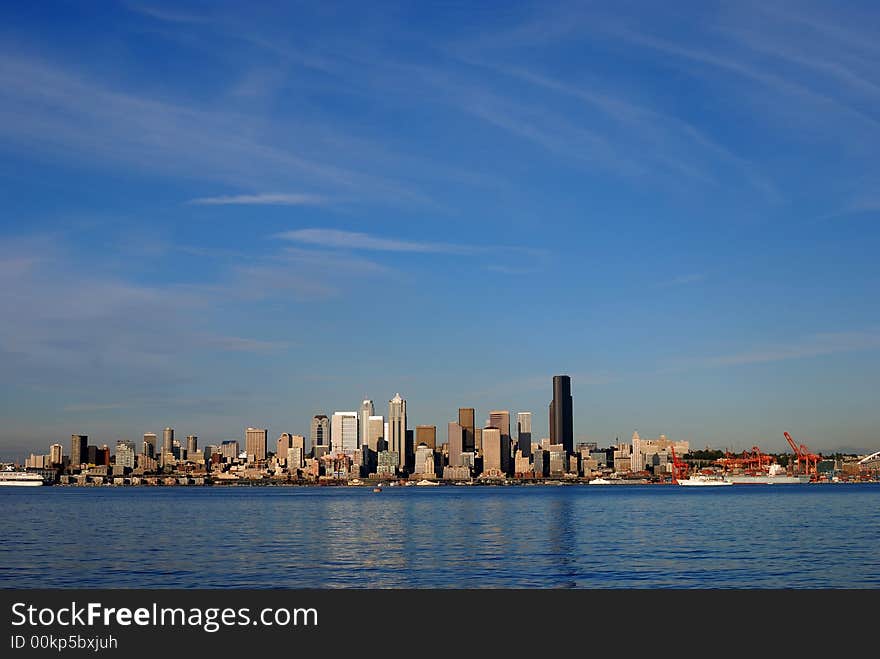 Seattle Skyline and beautiful blue sky accorss the water. Seattle Skyline and beautiful blue sky accorss the water