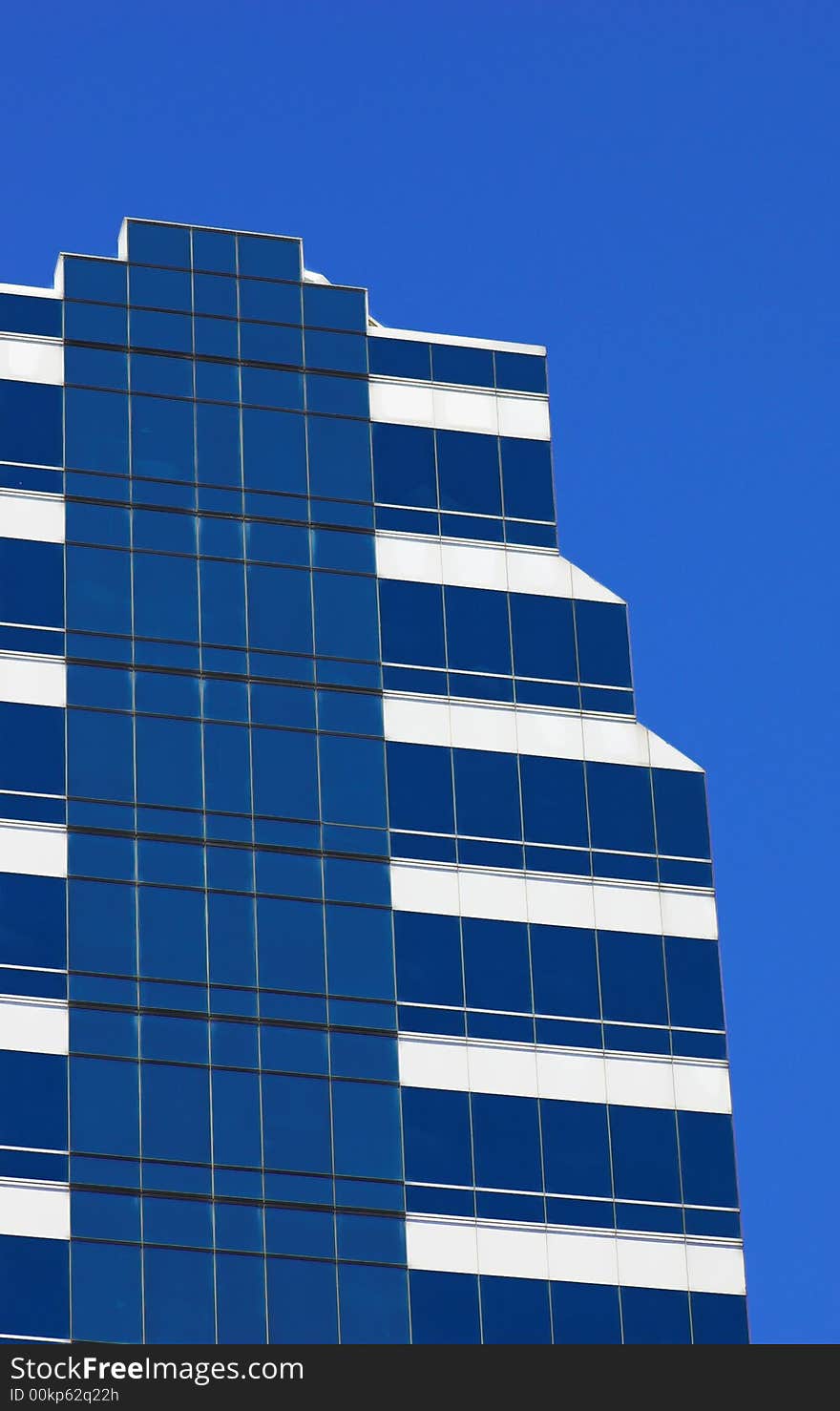 Blue corporate building against a blue sky. Blue corporate building against a blue sky