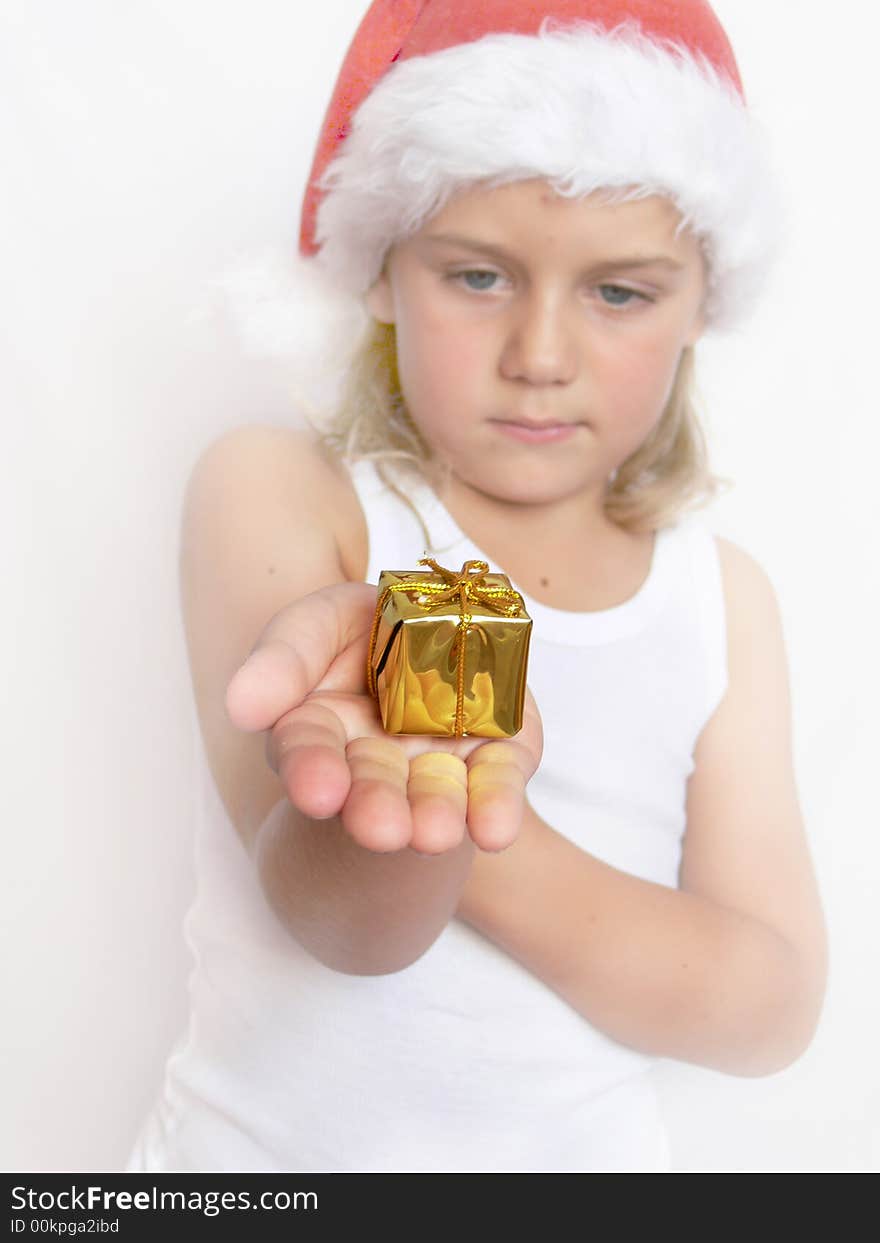 Child santa holding the gift. Child santa holding the gift