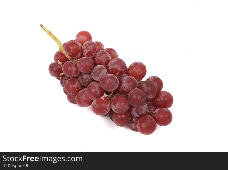 Red grapes on the white background